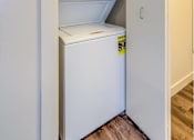Thumbnail 7 of 24 - A white dishwasher is built into a kitchen cabinet.