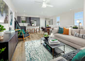 Thumbnail 10 of 20 - A living room with a couch, chairs, and a coffee table.