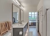 Thumbnail 19 of 50 - A bathroom with a towel hanging on the towel rack.