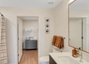 Thumbnail 24 of 50 - A bathroom with a towel hanging on the towel rack.