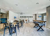 Thumbnail 20 of 33 - A room with a pool table and bar stools.