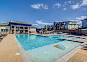 Thumbnail 23 of 33 - A swimming pool with a yellow logo on the side.