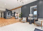 Thumbnail 15 of 30 - A modern living room with a grey and white polka dot rug.