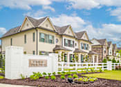 Thumbnail 1 of 26 - A sign that says "Villages at Shelby Station" is in front of a large house.