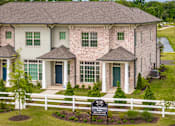 Thumbnail 21 of 26 - A house with a sign in front of it that says "Landing Information".