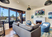 Thumbnail 17 of 43 - Clubroom With Fireplace at The Pacifica Apartments, Tacoma, Washington