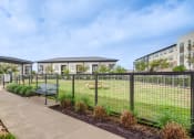 Thumbnail 19 of 26 - the preserve at ballantyne commons fenced in yard with benches and buildings