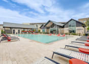 Thumbnail 13 of 26 - the resort style pool with lounge chairs at our apartments
