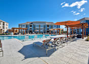 Thumbnail 19 of 29 - A pool area with sun loungers