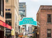 Thumbnail 13 of 18 - a city street sign that reads post alley