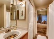 Thumbnail 4 of 18 - a bathroom with a sink and a mirror
