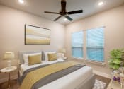 Thumbnail 21 of 28 - a bedroom with a bed and a ceiling fan