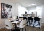 Thumbnail 2 of 24 - Living room and kitchen