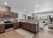 Thumbnail 3 of 50 - A modern kitchen with brown cabinets and a white countertop.