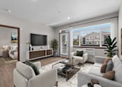 Thumbnail 4 of 50 - A modern living room with a large window overlooking a residential area.