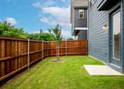 Thumbnail 17 of 28 - a backyard with a wooden fence and a house