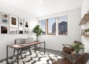 Thumbnail 5 of 16 - Home office with a desk and a window and a wall of framed photos