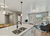 Thumbnail 5 of 42 - A modern kitchen with a large island and a sink.