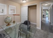 Thumbnail 10 of 28 - a dining room with a glass table and chairs