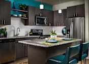 Thumbnail 5 of 15 - A modern kitchen with a table set for two.
