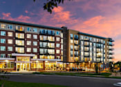 Thumbnail 15 of 15 - A large apartment building with a lot of windows and balconies.