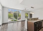 Thumbnail 7 of 32 - the preserve at ballantyne commons spacious living room and kitchen with large windows