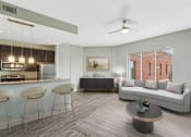 Thumbnail 3 of 32 - an open living room and kitchen with a couch and a table