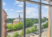 Thumbnail 6 of 32 - a view of a city from a window of a building