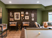 Thumbnail 64 of 68 - A billiard table is in the middle of a room with green walls.