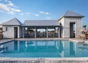 Thumbnail 3 of 40 - a house with a swimming pool in front of it
