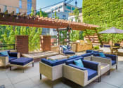 Thumbnail 27 of 44 - Outdoor patio with couches and a fire pit  at The Wyatt, Portland, Oregon