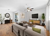 Thumbnail 3 of 24 - A Living Room With a Flat Screen TV at The Colony Apartments, Casa Grande, AZ, 85122