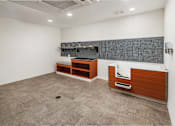 Thumbnail 16 of 27 - A bathroom with a tiled floor and a wooden vanity.