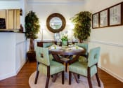 Thumbnail 5 of 13 - Dining room with a table and chairs