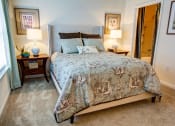 Thumbnail 2 of 13 - Bedroom with a bed and two night stands with lamps