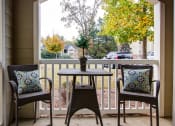 Thumbnail 6 of 13 - Porch with two chairs and a table