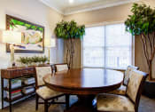 Thumbnail 9 of 13 - Dining room with a table and chairs and plants