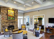 Thumbnail 12 of 13 - Seating area with fireplace and television