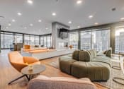 Thumbnail 7 of 30 - a living room with a couch and a table