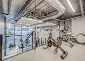 Thumbnail 3 of 30 - the gym at the district flats apartments in lenexa