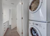 Thumbnail 27 of 30 - Full sized stacked front loading washer and dryer