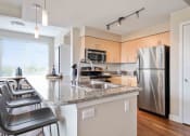 Thumbnail 4 of 43 - Gourmet Kitchen With Island at The Pacifica Apartments, Tacoma, WA, 98409