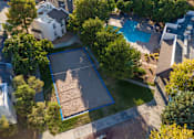 Thumbnail 24 of 51 - an aerial view of a neighborhood with a swimming pool and trees