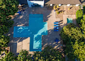 Thumbnail 23 of 51 - an aerial view of a swimming pool with a blue cross on it