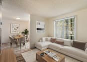 Thumbnail 41 of 51 - A living room with a white couch and a coffee table.