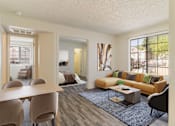Thumbnail 9 of 51 - an open living room and dining room with a couch and a table
