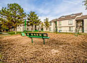 Thumbnail 36 of 51 - the preserve at ballantyne commons park bench in front of apartment buildings