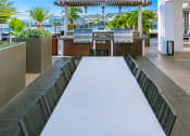 Thumbnail 14 of 30 - Community Outdoor Grill Area at AV8 Apartments in San Diego, CA