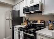 Thumbnail 8 of 44 - Well Equipped Kitchen at Odyssey Apartments, New Mexico, 87114
