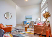 Thumbnail 11 of 21 - Model living room